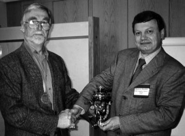 Sasha presenting medal to Alan