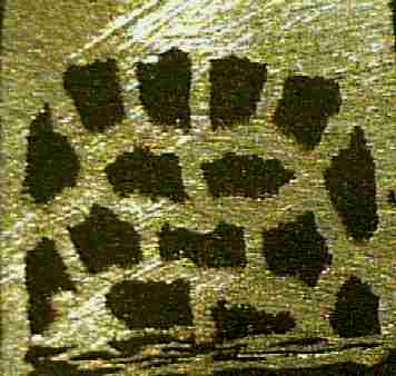 Video image of superconductor tape with conducting filaments exposed by polishing the tape at an oblique angle. Each filament is about 200-500 microns thick
